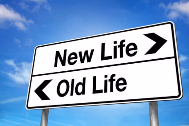 Signs with one pointing right saying New Life and one pointing left saying Old Life.